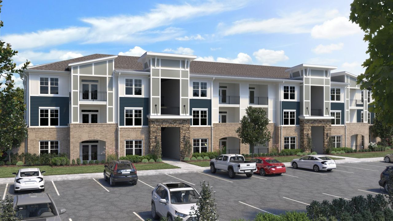 Hawthorne Northwest exterior rendering of apartment buildings in front of a parking area